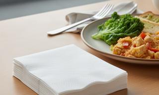 Compact stack of everyday luncheon napkins beside a casual meal