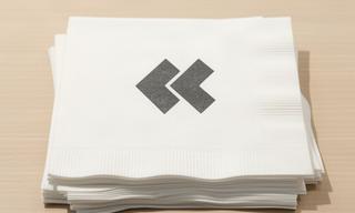 Custom printed paper napkins showing a simple café logo in one colour